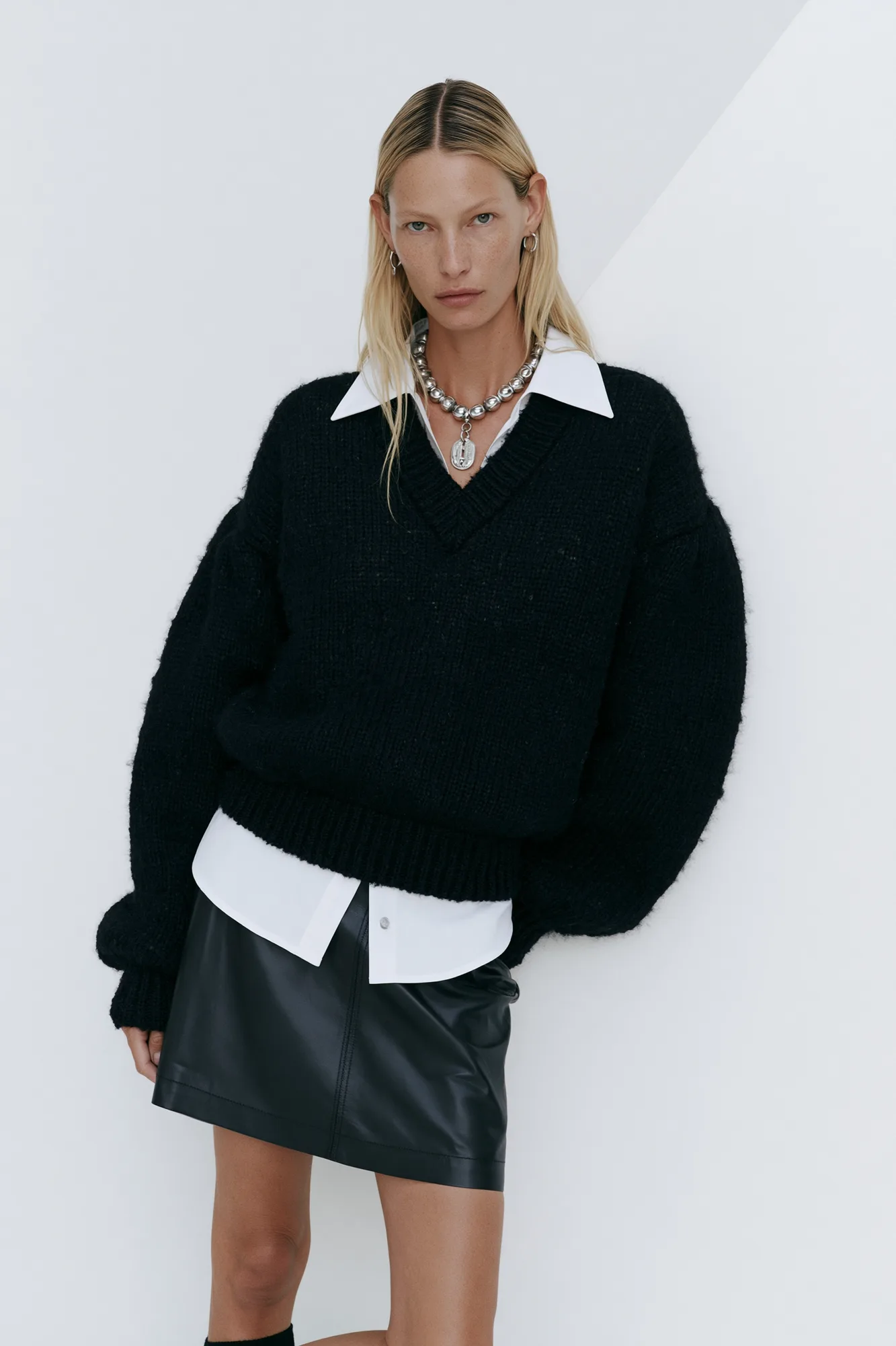 Black knit and leather look with silver necklace